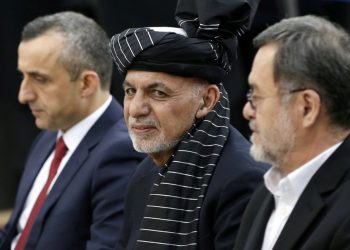 Afghan President Ashraf Ghani, alongside his two vice president candidates Amrullah Saleh, left, and Sarwar Danish, right, arrives to register as a candidate for presidential election at the Afghanistan Independent Election Commission (IEC) in Kabul in this Jan. 20, 2019 file photo (Reuters)