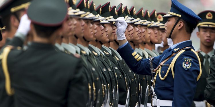 Chinese military officers use a piece of rope to line up honor guards as they prepare for a welcome ceremony for Greece's Prime Minister Antonis Samaras at the Great Hall of the People in Beijing Thursday, May 16, 2013. (AP)
