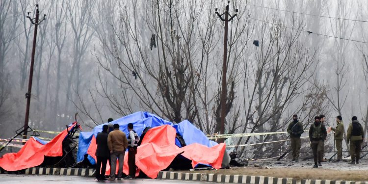 Lethpora: Security agencies inspect the site of suicide bomb attack at Lethpora area, in Pulwama district of south Kashmir, Friday, Feb. 15, 2019. At least 37 CRPF personnel were killed yesterday in one of the deadliest terror attacks in Jammu and Kashmir when a Jaish suicide bomber rammed a vehicle carrying over 100 kg of explosives into their bus in Pulwama district. (PTI Photo/S Irfan)(PTI2_15_2019_000036B)