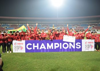 Triumphant Myanmar players pose with the winners’ trophy at the Kalinga Stadium in Bhubaneswar, Friday  