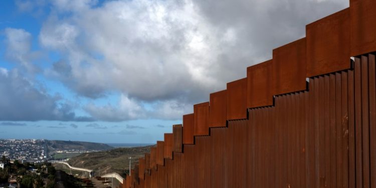 A section of the steel wall on the US - Mexico border near San Diego, California (AFP)