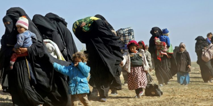 SDF spokesman Mustefa Bali said on Tuesday that 600 civilians had fled the combat zone overnight and the Syrian Observatory for Human Rights said another 350 made it out that day (AFP)