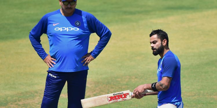 Indian captain Virat Kohli along with coach Ravi Shastri during their practice session at Chinnaswamy Stadium, Tuesday   