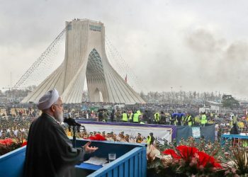 Iranian President Hassan Rouhani addresses crowds during a ceremony celebrating the 40th anniversary of the Islamic revolution February 11, 2019 (AFP)