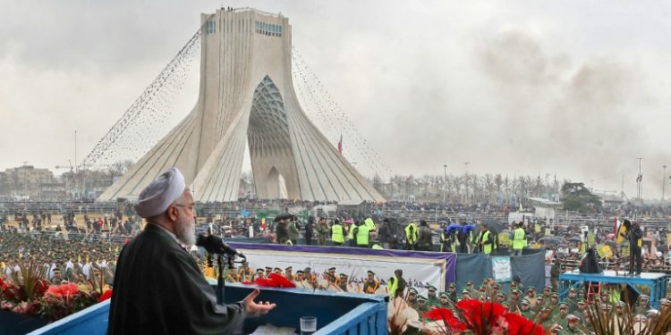 Iranian President Hassan Rouhani addresses crowds during a ceremony celebrating the 40th anniversary of the Islamic revolution February 11, 2019 (AFP)