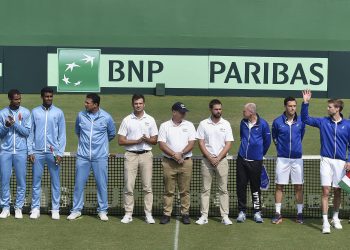 The Indian and Italian teams along with match officials pose before the start of the Davis Cup tie in Kolkata