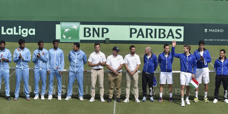 The Indian and Italian teams along with match officials pose before the start of the Davis Cup tie in Kolkata