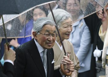 Japan's Emperor Akihito, left, and Empress Michiko, right, greet the guests during the autumn garden party at the Akasaka Palace imperial garden in Tokyo. (AP)