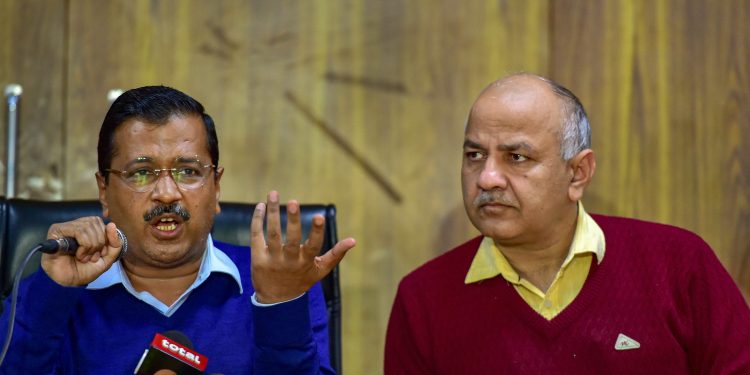 Delhi Chief Minister Arvind Kejriwal (L) and Deputy Chief Minister Manish Sisodia during the press conference, Thursday