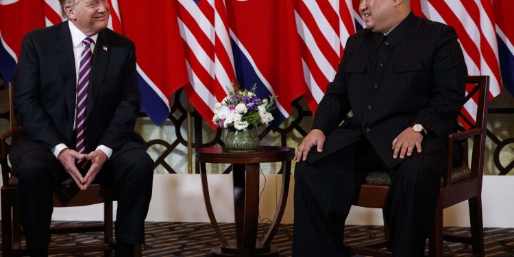 Donald Trump and Kim Jong Un share a light moment Wednesday evening at Hanoi