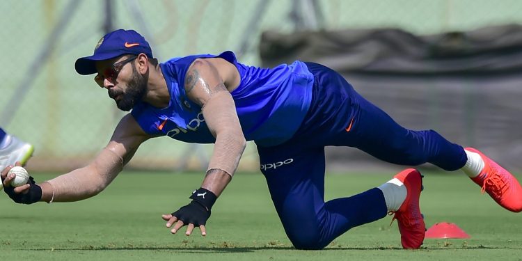 Indian skipper Virat Kohli takes a tumbling while going through the fielding drills