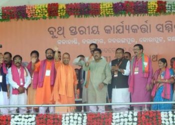 Yogi Adityanath and Dharmendra Pradhan along with other senior BJP leaders at the rally, Wednesday