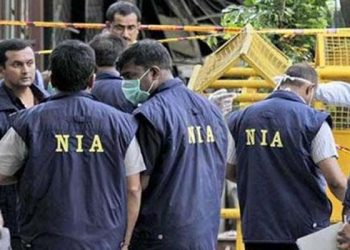 NIA personnel investigating the attack site (PTI)