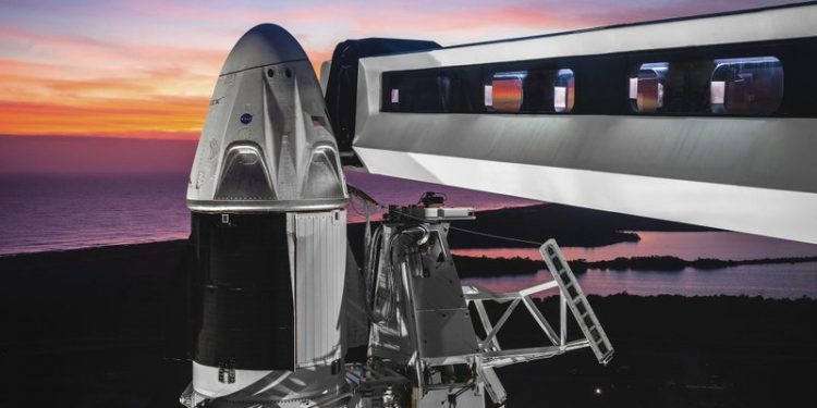 This undated photo made available by SpaceX Feb 6, 2019 shows the Dragon crew capsule atop a Falcon 9 rocket at the launch pad at Kennedy Space Center in Florida where the Saturn Vs and space shuttles were launched. Friday, Feb. 22, 2019, NASA and SpaceX announced the approval of an unmanned test flight for the new commercial capsule. (SpaceX via AP)