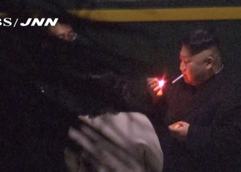 In this image made from Japan’s TBS TV video on early Tuesday, Feb. 26, 2019, North Korean leader Kim Jong Un, a habitual smoker, takes a pre-dawn smoke break at the train station in Nanning, China, hours before his arrival in Vietnam for his high-stakes summit with President Donald Trump over resolving the international standoff over the North’s nuclear weapons and missiles. (TBS-JNN via AP)