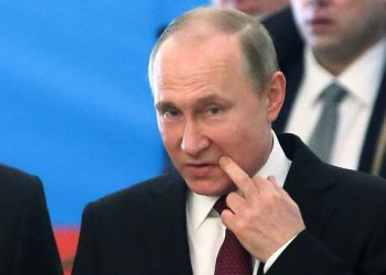 Russian President Vladimir Putin at a polling station during the presidential election in Moscow (REUTERS)