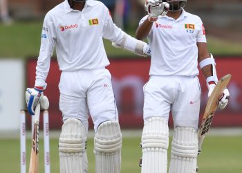 Kusal Mendis (L) and Oshada Fernando react in the field after their victory against South Africa in Port Elizabeth, Saturday