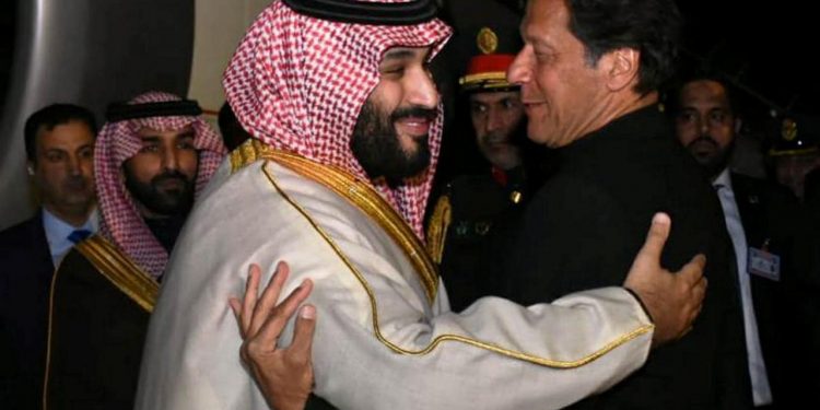 Pakistani Prime Minister Imran Khan (R) greets Saudi Arabia's Crown Prince Mohammed bin Salman on his arrival at Pakistan Air Force (PAF) Nur Khan Base in Rawalpindi, Pakistan February 17, 2019. Press Information Department (PID)/Handout via REUTERS