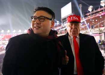 People dressed-up as U.S. President Donald Trump and North Korean leader Kim Jong Un attend the Winter Olympics opening ceremony in Pyeongchang, South Korea February 9, 2018. (REUTERS)