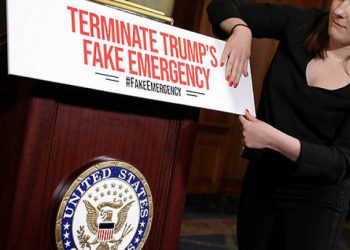 Staff from the office of Speaker of the House Nancy Pelosi (C) prepare for a news conference on the resolution to terminate President Donald Trump’s emergency declaration. (AFP)