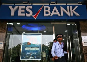 A watchman steps out of a Yes Bank branch in Mumbai, India,  (REUTERS)