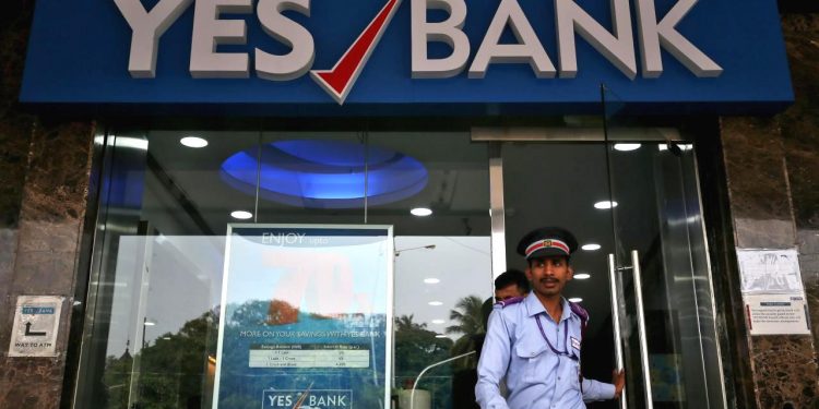 A watchman steps out of a Yes Bank branch in Mumbai, India,  (REUTERS)