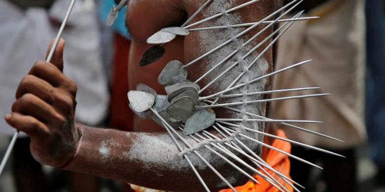 A Hindu devotee with his body pierced with metal skewers takes part in a procession during the Thaipusam festival on the outskirts of Kochi, India, January 21, 2019. (REUTERS/Sivaram V)