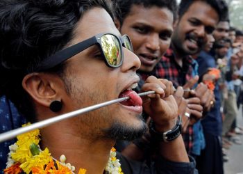 A Hindu devotee with his tongue pierced with a metal skewer takes part in a procession during the Thaipusam festival on the outskirts of Kochi, India, January 21, 2019. (REUTERS/Sivaram V)