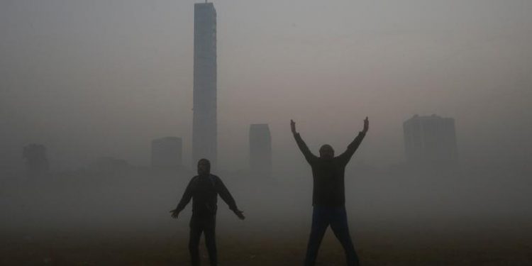 Men exercise inside a public park on a foggy winter morning in Kolkata, India, January 3, 2019. (REUTERS/Rupak De Chowdhuri)