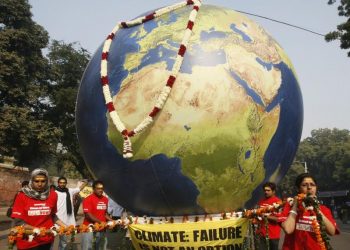 Greenpeace activists carry a model of the earth during a mock funeral procession in New Delhi December 21, 2009. (REUTERS)
