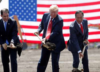 U.S. President Donald Trump, center, takes part in a groundbreaking with Wisconsin Gov. Scott Walker, left, and Foxconn Chairman Terry Gou at Foxconn's new site in Mount Pleasant, Wisconsin, on June 28. (Reuters)