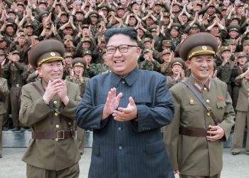 North Korean leader Kim Jong Un claps with military officers at the Command of the Strategic Force of the Korean People's Army (KPA) in an unknown location in North Korea