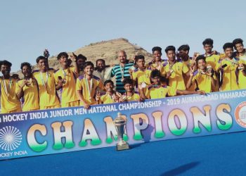 Triumphant Hockey Odisha players pose with the winners’ trophy, Thursday      