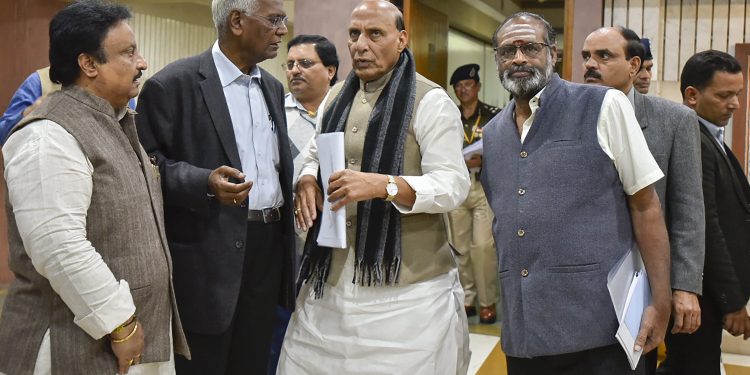 Home Minister Rajnath Singh talks with leaders of various political parties after the conclusion of the meeting, Saturday