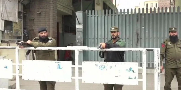 Armed guards outside JuD headquarters