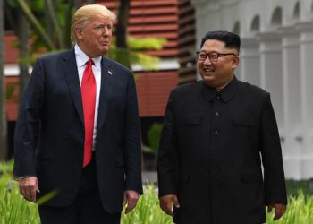 North Korea's leader Kim Jong Un (R) walks with US President Donald Trump (L) during a break in talks at their historic US-North Korea summit, at the Capella Hotel on Sentosa island in Singapore on June 12, 2018. AFP PHOTO / SAUL LOEBSAUL LOEB/AFP/Getty Images