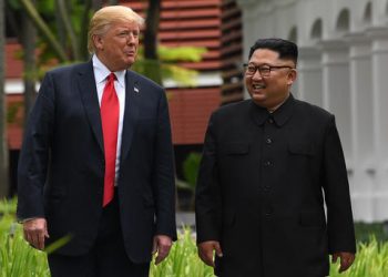 North Korea's leader Kim Jong Un (R) walks with US President Donald Trump (L) during a break in talks at their historic US-North Korea summit, at the Capella Hotel on Sentosa island in Singapore on June 12, 2018. AFP PHOTO / SAUL LOEBSAUL LOEB/AFP/Getty Images