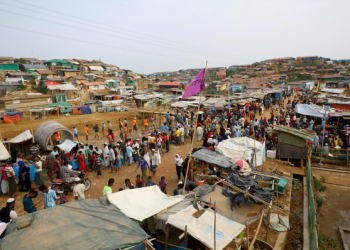Rohingya refugees gather at a market inside a refugee camp near Cox Bazaar in Bangladesh