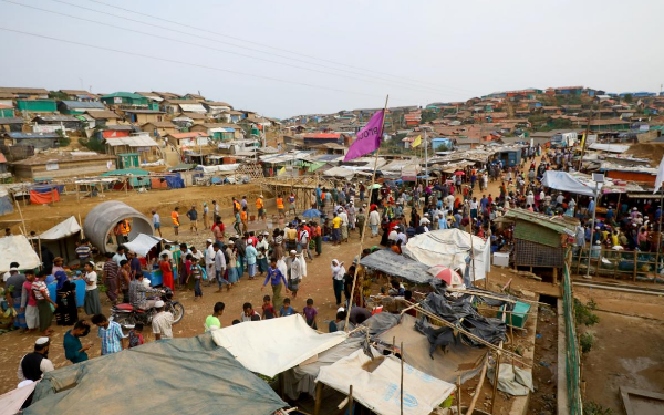 Rohingya refugees gather at a market inside a refugee camp near Cox Bazaar in Bangladesh