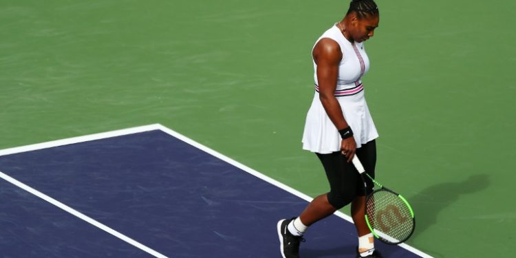 Serena Williams is out of Indian Wells after retiring while trailing Spain's Garbine Muguruza in their third-round match of the WTA hardcourt tournament (AFP)