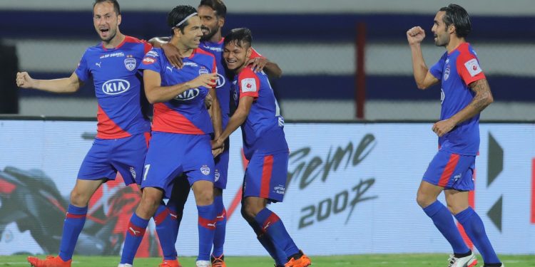 Bengaluru FC players celebrate after scoring the first goal against NEUFC, Monday