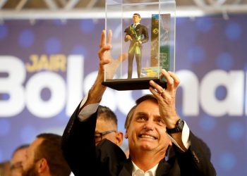 FILE PHOTO: Presidential candidate Jair Bolsonaro, shows a doll of himself during a rally in Curitiba, Brazil March 29, 2018. (REUTERS)