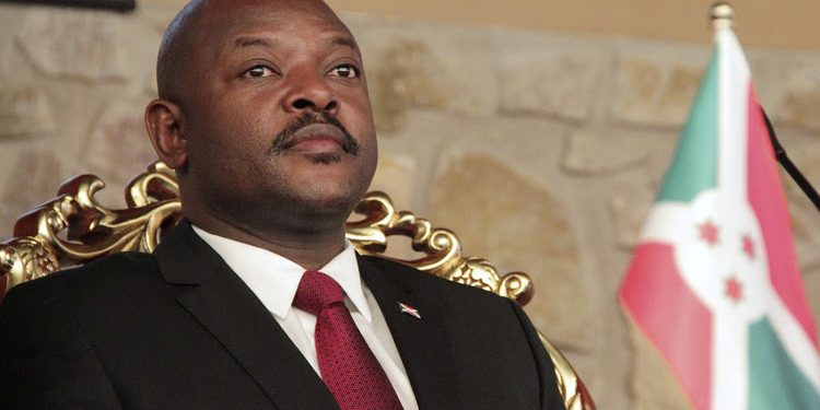 The girls are accused of defacing photographs of Nkurunziza (pictured) in five textbooks belonging to their school. (Image: Reuters)
