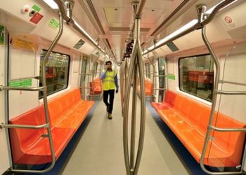 A passenger walks the cabin of a Delhi metro [Representational Image] (PTI)