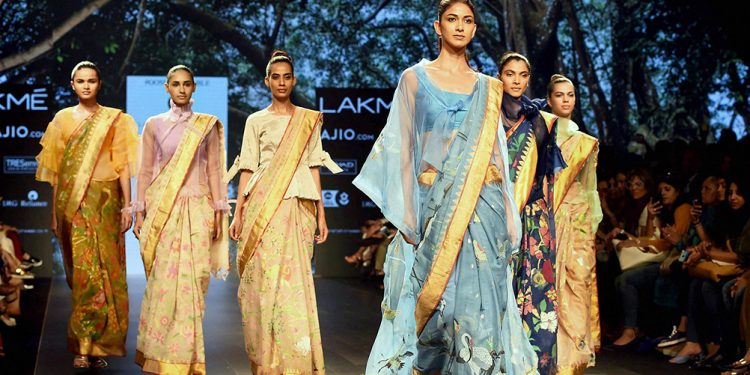 Mumbai: Models walk the ramp during the Lakme Fashion Week in Mumbai on Thursday. PTI Photo by Mitesh Bhuvad (PTI)