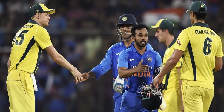 Australian players congratulate Kedar Jadhav and MS Dhoni after their match-winning partnership helped India clinch victory if the first ODI