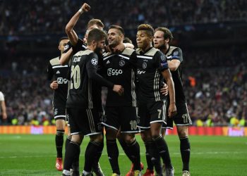 Dusan Tadic (No.10) is congratulated by teammates after scoring Ajax’s third goal in their Champions League encounter against Real Madrid, Tuesday