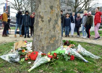 Mourners laid flowers at the site of the tram shooting in the Dutch city of Utrecht (AFP)