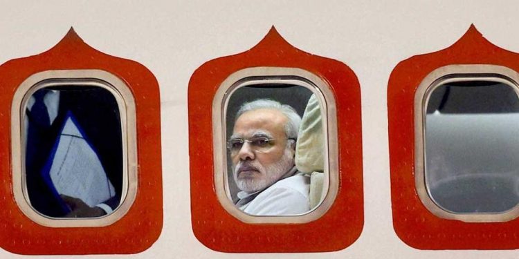 A 2014 file photo of Prime Minister Narendra Modi in his special aircraft as he arrived at the Brasilia International Airport in Brazil. (PTI)