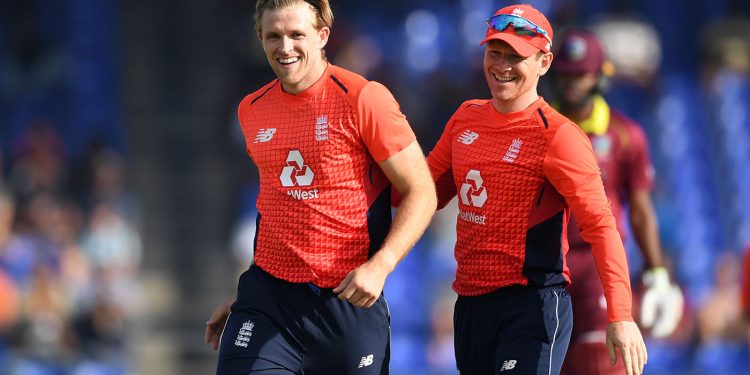 David Willey (L), along with England skipper Eoin Morgan, is all smiles after dismissing a Windies batsman, Sunday